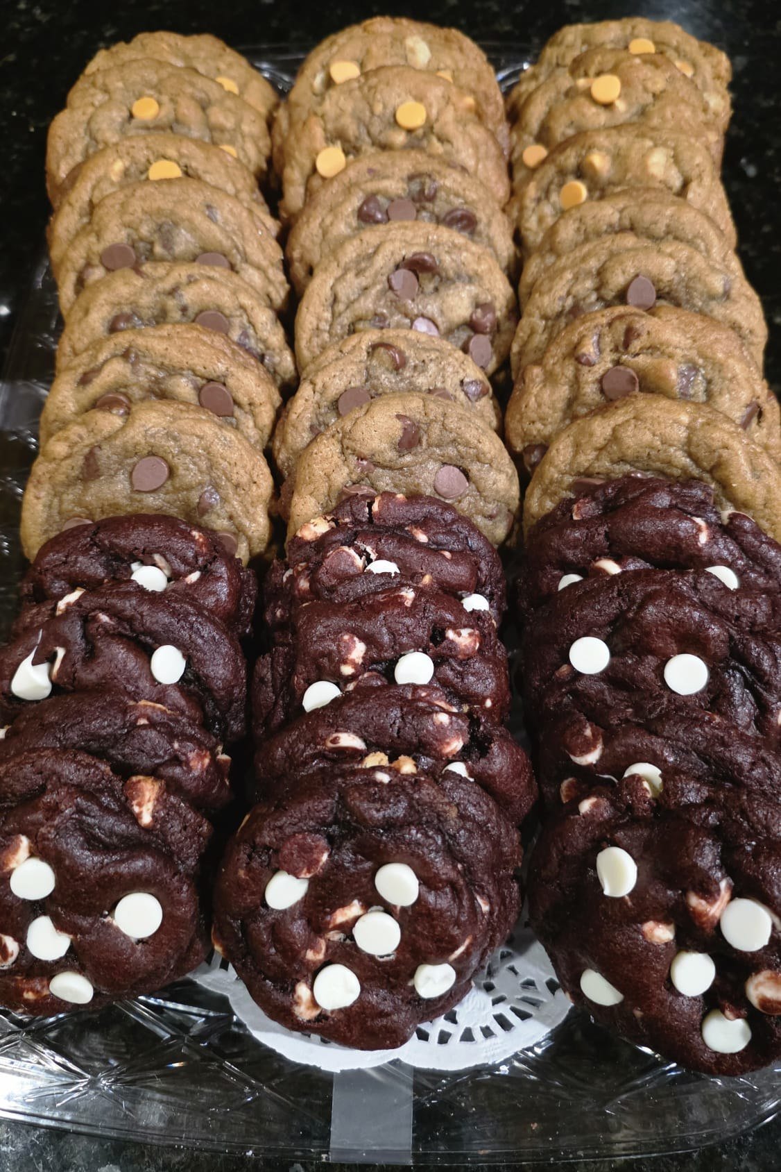 Tray of Triple Threat cookies, rows of chocolate chip cookies alongside dark chocolate cookies studded with white chocolate chips